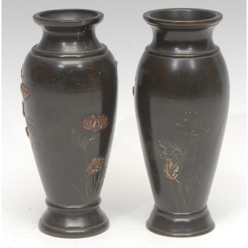 1652 - A pair of Meiji period Japanese dark patinated bronze and shakudo mounted vases, of shouldered form,... 