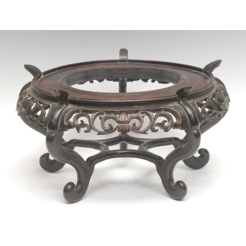 1861 - A Qing period Chinese hardwood fish bowl or jardinière stand, fretwork frieze above a cinqueform str... 