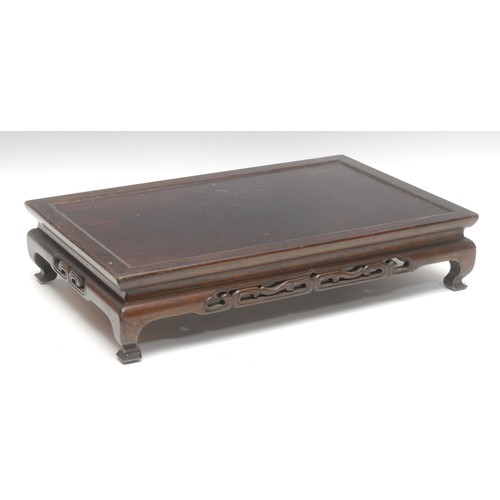 1426 - An early 20th century Chinese hardwood stand or scholar's table, pierced friezes, cabriole legs, 10.... 