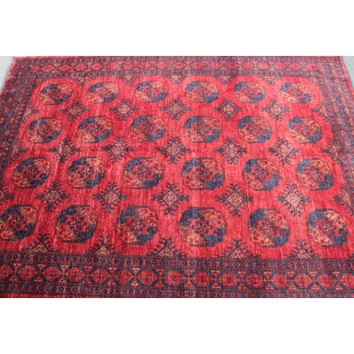 2064 - An Afghan design Ersari type rectangular wool rug or carpet, 353cm x 251cm