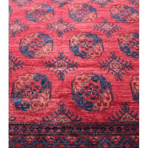 2064 - An Afghan design Ersari type rectangular wool rug or carpet, 353cm x 251cm