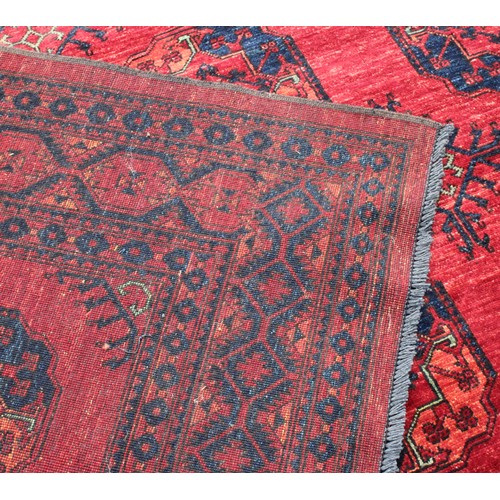 2064 - An Afghan design Ersari type rectangular wool rug or carpet, 353cm x 251cm