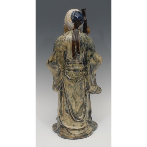 1197 - A Chinese clay figure, of Shou Lao (Shou Xing), decorated in underglaze tones of mottled blue and br... 