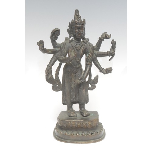 1706 - A 19th century Indian dark patinated bronze, as Vishnu, he stands on a lotus leaf, 19.5cm high overa... 