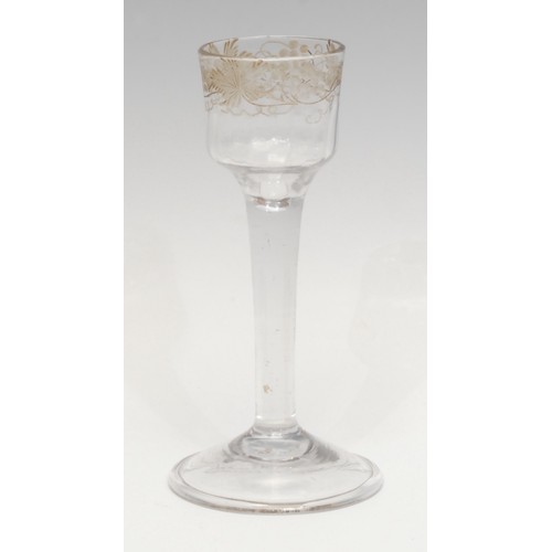 1375 - An 18th century cordial glass, the ogee bucket bowl etched with fruiting vine, plain straight stem, ... 