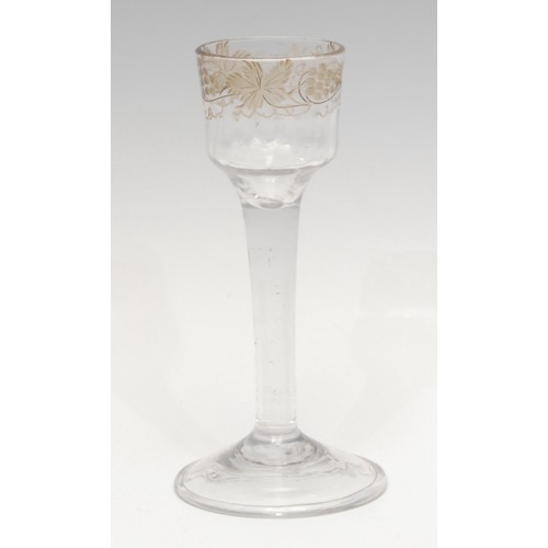 1375 - An 18th century cordial glass, the ogee bucket bowl etched with fruiting vine, plain straight stem, ... 