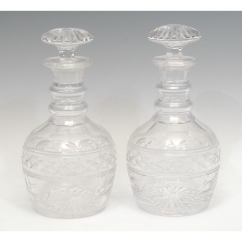 1369 - A pair of late Victorian cut glass decanters, stepped collars above hobnail patterns, mushroom stopp... 