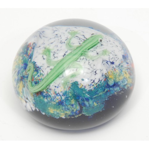 1364 - A glass domed paperweight, the interior with a lizard inclusion, 8cm diameter