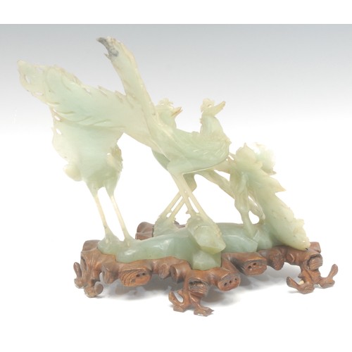 1390 - A Chinese export ware jade sculpture on stand, of cocks fighting, 24.5cm high overall