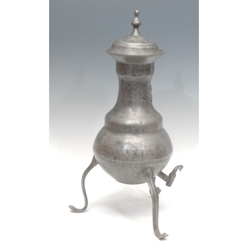 1823 - A Dutch pewter kraantjeskan or samovar, of ovoid form, applied fleur-de-lis, swan neck spigot, suppo... 