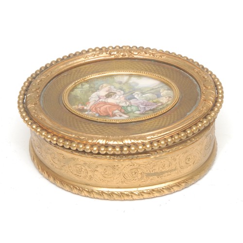 1517 - A 19th century Continental gilt metal oval sewing box, the hinged cover mounted with maidens attende... 