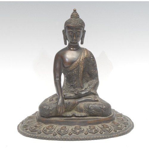 1707 - A 19th century Indian patinated bronze, as a Buddha sitting on a lotus leaf, 17.5cm high overall