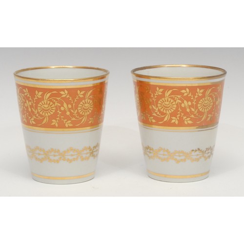 1298 - A pair of Flight Barr Worcester beakers, decorated with gilt foliate scrolls on a broad salmon band,... 