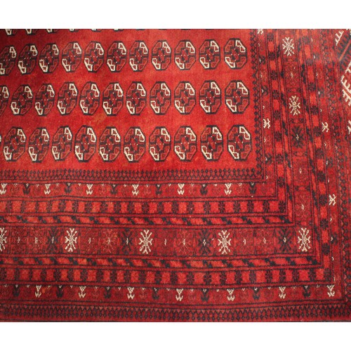 2066 - An Afghani Mauri Dazar carpet, with four rows of geometric guls, within multi layer borders, approx ... 