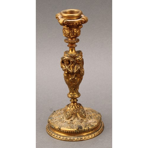 1660 - A 19th century French Bacchanalian gilt bronze candlestick, well cast with the Cherubs representing ... 