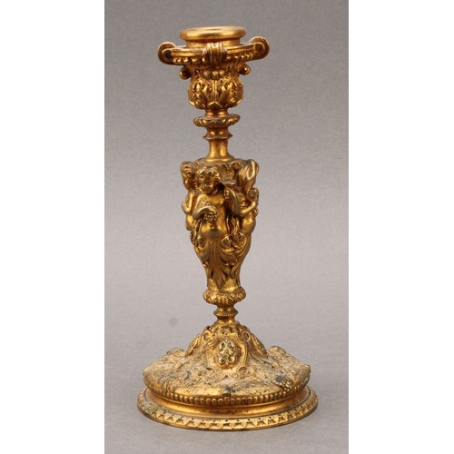 1660 - A 19th century French Bacchanalian gilt bronze candlestick, well cast with the Cherubs representing ... 