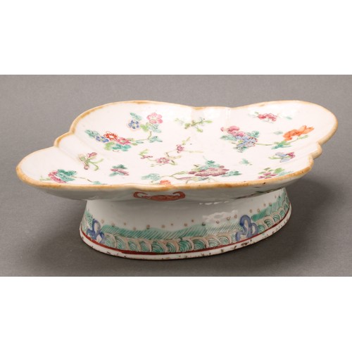 1403 - A Chinese lobed quatrefoil footed dish, painted in polychrome enamels with flowers, peaches and bats... 