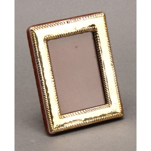 303 - A Continental gold rectangular easel photograph frame, gadrooned borders, 8.5cm high, marked 333, 20... 