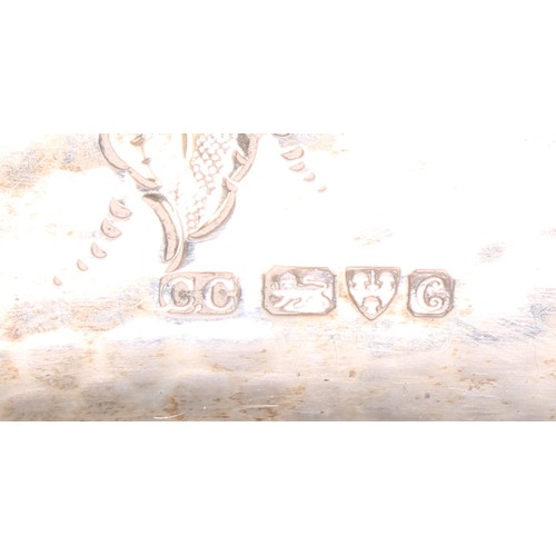 340 - An Art Nouveau silver shaped rectangular dressing table tray, the field chased with a flower and lea... 