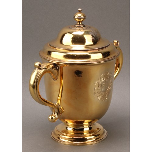 260 - A George I Britannia silver-gilt loving cup and cover, knop finial, acanthus-capped scroll handles, ... 