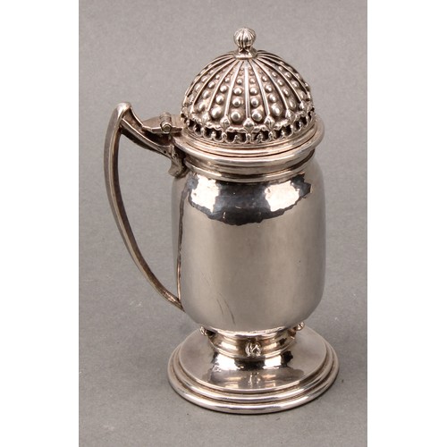 295 - Omar Ramsden - an Arts and Crafts silver mustard, hinged domed cover, angiular scroll handle, lightl... 