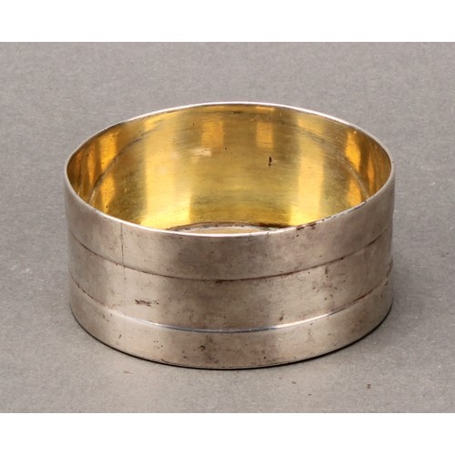 488 - An Irish provincial silver circular salt, the side with faux-coopered bands, gilt interior, 6.5cm di... 