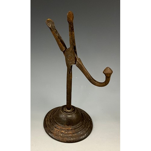 1877 - An 18th/19th century cast iron nip rushlight holder, domed base, 21.5cm high