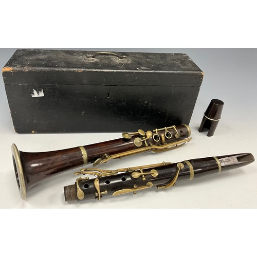 1469 - A late 19th century rosewood clarinet, unsigned four section body, silver plated mounts and valves, ... 