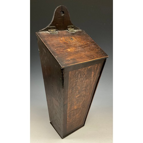 1829 - A George III mahogany crossbanded oak tapered rectangular candle box, shaped cresting, hinged slopin... 