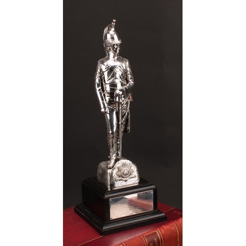 191 - Military Interest - an Elizabeth II silver coloured metal presentation figure, an officer of the 4th... 