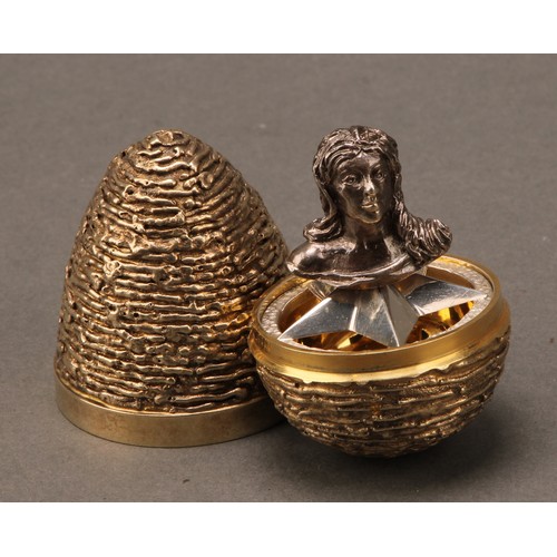 300 - Richard Lawrence Geere -  a silver and silver-gilt surprise egg, in the manner of Stuart Devlin, tex... 