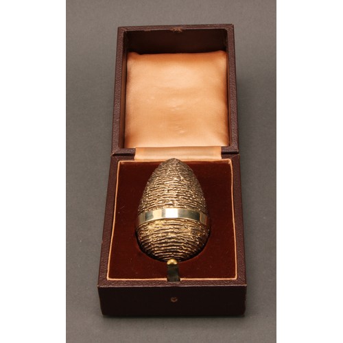 300 - Richard Lawrence Geere -  a silver and silver-gilt surprise egg, in the manner of Stuart Devlin, tex... 