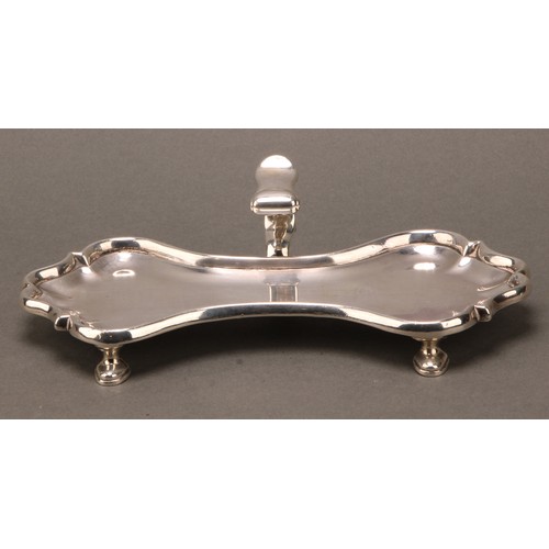 266 - A George II silver candle snuffer tray, of substantial gauge, flying-scroll handle, hoof feet, 18.5c... 