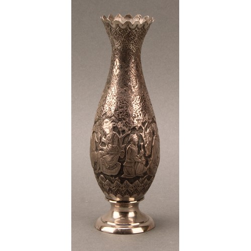 487 - An Iranian silver slender baluster vase, chased with  narrative scenes on a dense lotus ground, 18cm... 