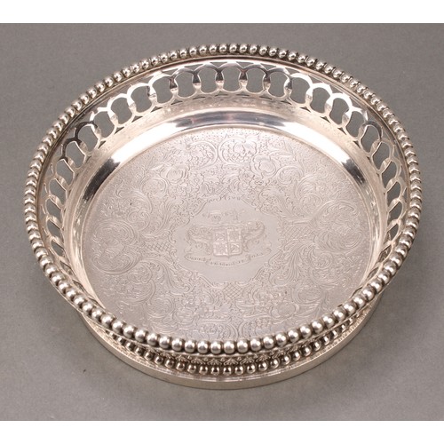 207 - A set of four 19th century French cast silver wine coasters, of substantial gauge, pierced and beade... 