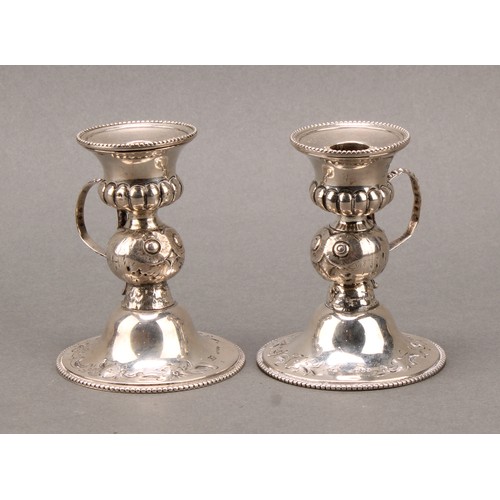 153 - A pair of Victorian silver novelty chambersticks, each stem as an owl, half-fluted campana sconces, ... 