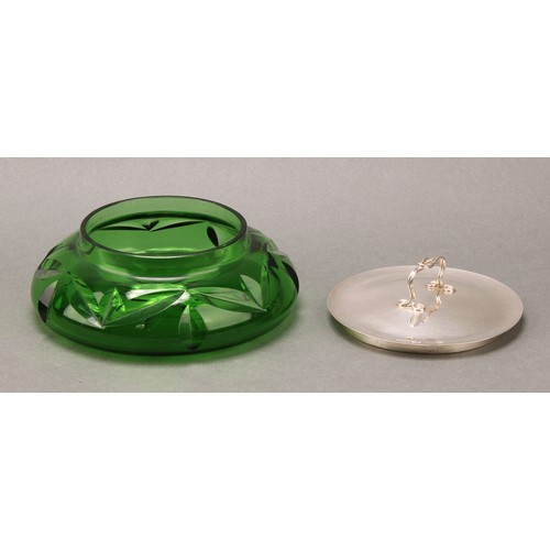 299 - Ramsden & Carr - an Arts and Crafts silver mounted green glass dressing table bowl, planished push-f... 