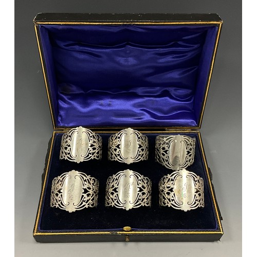 2025 - A set of six John Round and Son decoratively pierced napkins, engraved initials and numbered, cased,... 