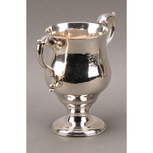 384 - A pair of George III Irish silver pedestal bell shaped loving cups, acanthus-capped scroll handles, ... 