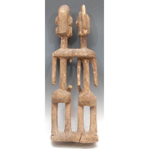 1432 - Tribal Art - a Dogon figural carving, depicting the primordial couple, 59cm high, Mali, West Africa