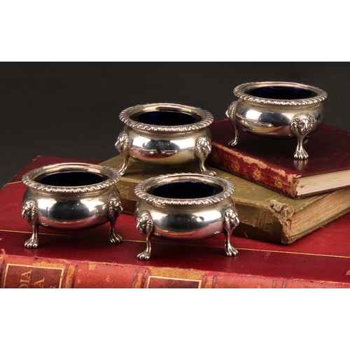 398 - A set of four Scottish Regency silver cauldron salts, gadrooned borders, lion monopodia, 7cm diam, G... 