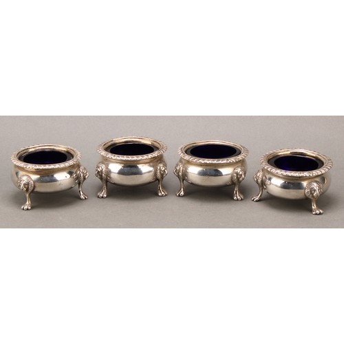 398 - A set of four Scottish Regency silver cauldron salts, gadrooned borders, lion monopodia, 7cm diam, G... 