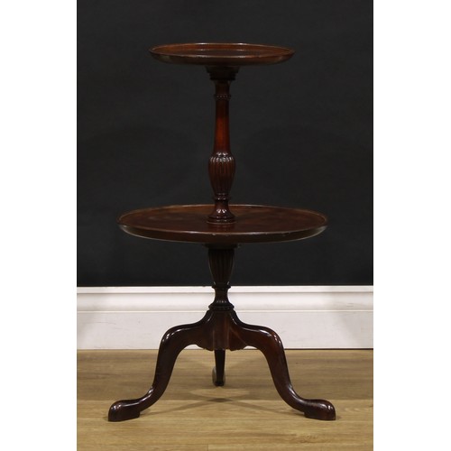 1686 - A George III Revival mahogany table-top two-tier dumbwaiter, dished circular plateaux, turned and fl... 