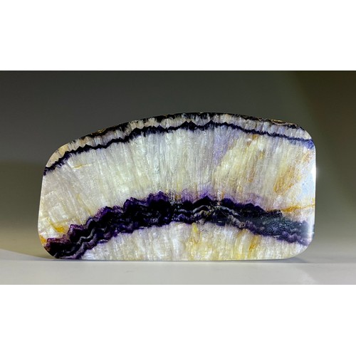 1951 - A Derbyshire Blue John fluorite specimen slice, slightly arched form, 4cm x 7.3cm, 13cm high, 5.8cm ... 