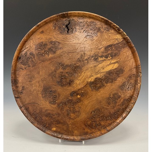 1893 - Treen - a 19th century burr elm circular bread board, 31.5cm diam