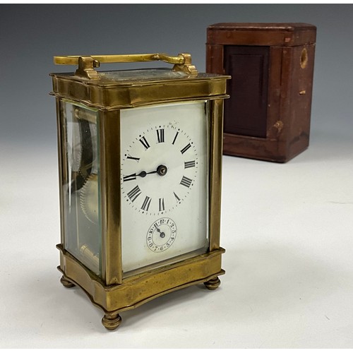 1979 - An early 20th century carriage clock, brass serpentine case, white dial, bell striking movement sign... 