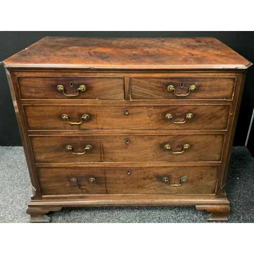 1597 - A George III mahogany chest of drawers, the slightly over-sailing top, with canted corners, fluted s... 