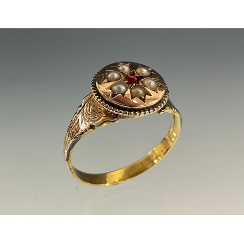 531 - A 19th century ruby and seed pearl ring, circular shield crest with rough cut pink ruby surrounded b... 