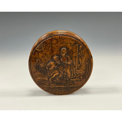 724 - Snuff Boxes  - a 19th century pressed wood circular snuff box, Filial Pity, An elderly Prisoner cond... 