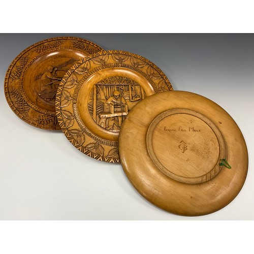 1545 - A set of three carved English field maple plaques, each with traditional craftsmen and past times in... 